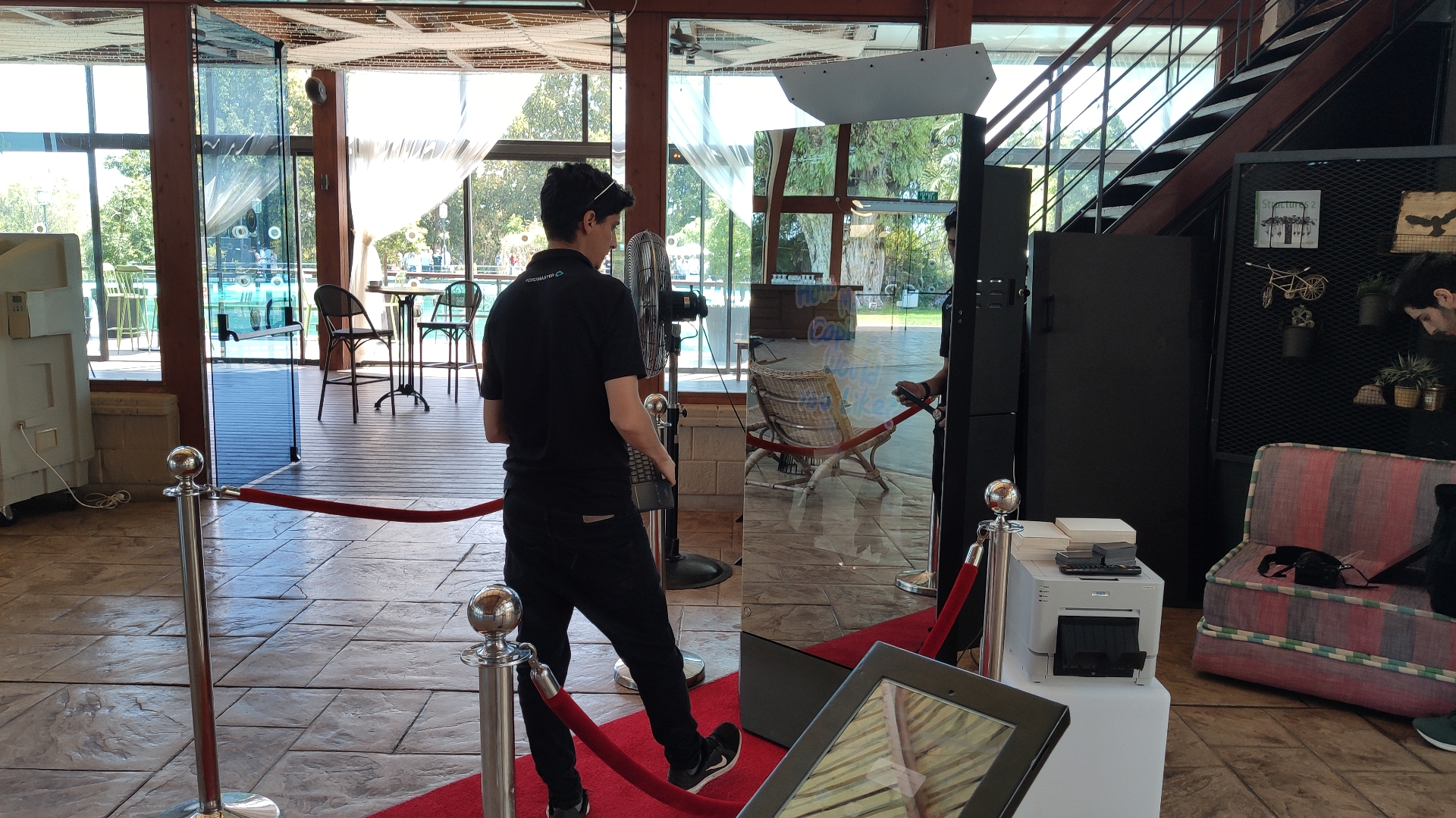 TallyBooth mirror booth setup with red carpet and velvet ropes at venue